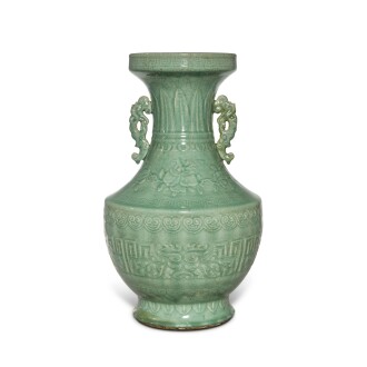 View 1 of Lot 636: A large carved celadon-glazed vase, Qing dynasty, 18th / 19th century | 清十八 / 十九世紀 青釉刻仿古紋雙耳大瓶