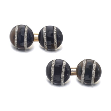 Catalog image of pair of onyx and diamond cufflinks, early 20th century