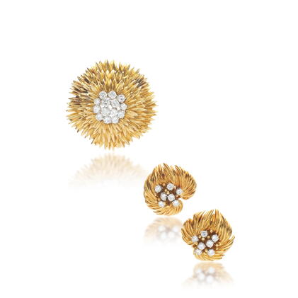 Catalog image of Gold and diamond brooch and a pair of ear clips, circa 1960