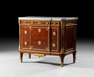 View 1 of Lot 126: A Louis XVI gilt-bronze-mounted mahogany commode, attributed to Jean-Henri Riesener, circa 1785 | Commode en acajou moucheté et bronze doré d'époque Louis XVI, vers 1785, attribuée à Jean-Henri Riesener