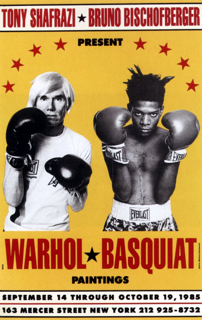 A bright yellow poster mimics a boxing match poster to announce an exhibition featuring Andy Warhol and Jean-Michel Basquiat. Black-and-white photographs of Warhol (left) and Basquiat (right) show the artists wearing boxing gloves with fists up.