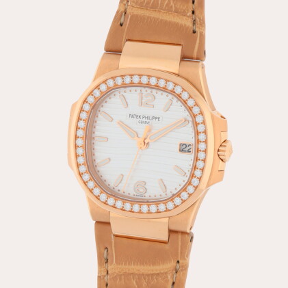 Catalog image of Nautilus, Reference 7010R-011 | A pink gold and diamond-set wristwatch with dat…
