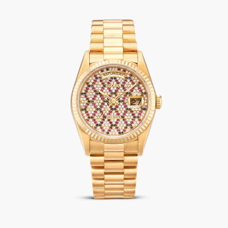 View 1 of Lot 8601: Day-Date, Reference 18238 | A yellow gold, diamond, sapphire and ruby-set wristwatch with day, date, honeycomb dial and bracelet, Circa 1996