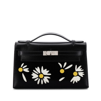 View 1 of Lot 517: Limited Edition Black Box, White and Jaune Chèvre Inlay Daisy Kelly Pochette Palladium Hardware, 2026