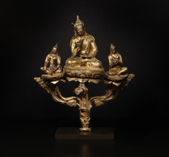 View 1 of Lot 820: A gilt copper alloy triad of Padmasambhava with Yeshe Tsogyal and Mandarava, Tibet, 15th century