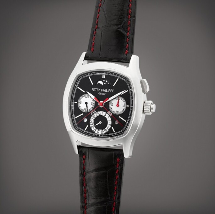 Patek Philippe Reference 5951P, platinum cushion-shaped perpetual calendar split-seconds chronograph wristwatch with moon phases, day/night and leap year indications, calibre CHR 27-525 PS Q, shown with black dial and red chronograph hands.