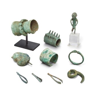 View 1 of Lot 3121: A group of 10 bronze ornaments including a rare 'stargazer' figure, Dong Son culture, 5th – 1st century BCE 公元前五至一世紀 東山 各式青銅器物一組十件 包括一觀星者像