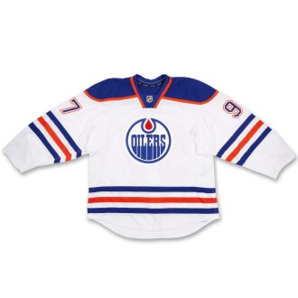 View 1 of Lot 8: Connor McDavid "First NHL Goal” Edmonton Oilers 2015-16 Game-Worn White Set 1 Away Jersey | Worn During Connor McDavid’s First NHL Goal | Connor McDavid’s First Career Point | Worn in Connor McDavid’s Second and Third Career Games | Rookie Season | Matched to 2 Games
