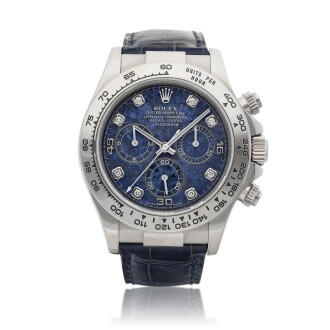 View 1 of Lot 8236: Cosmograph Daytona, Reference 116519 | A white gold and diamond-set chronograph wristwatch with sodalite dial, Circa 2000 | 勞力士 Cosmograph Daytona 型號116519 | 白金鑲鑽石計時腕錶，備方鈉石錶盤，約2000年製
