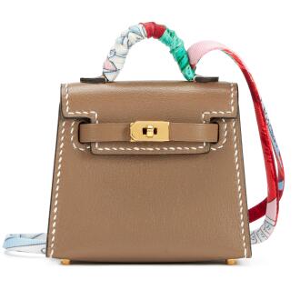 View 1 of Lot 208: Etoupe Tadelakt Micro Mini Kelly Twilly Bag Charm Gold Hardware, 2020