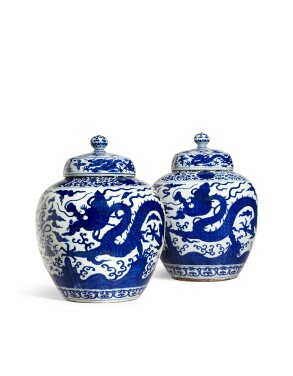View 1 of Lot 1074: A pair of massive blue and white 'dragon' jars and covers, Marks and period of Jiajing | 明嘉靖　青花雲龍供壽紋蓋罐一對　《大明嘉靖年製》款