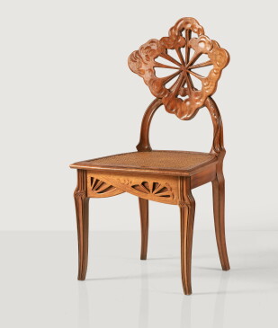Émile Gallé, La Berce des Prés or Ombelles chair, circa 1902. Carved walnut and cane, Signed Gallé on one leg. Estimate €8,000-12,000.
