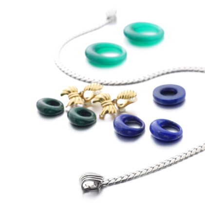 Catalog image of pair of ear clips and a necklace