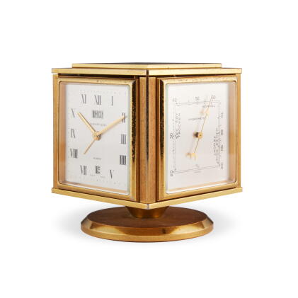 Catalog image of A gilt brass 8 day desk compendium with day and date, alarm, thermometer, barom…