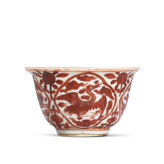 View 1 of Lot 5049: A rare iron-red 'crane' cup, Mark and period of Jiajing 明嘉靖 礬紅彩開光壽鶴紋盃 《嘉靖年製》款