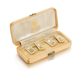 View 1 of Lot 193: A pair of Fabergé two-colour gold and champlevé enamel naval ‘epaulet’ cufflinks, workmaster Alfred Thielemann, St Petersburg, 1904-1908
