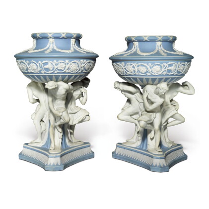 Catalog image of a pair of wedgwood blue and white jasper-dip 'michelangelo' vases circa 1840