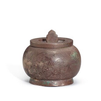 View 1 of Lot 5009: An engraved silver tea caddy and cover, Late Tang dynasty 唐末 銀鏨花卉紋茶罐