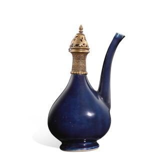 View 1 of Lot 9727: A gilt-copper mounted blue-glazed ewer | 藍釉鎏金銅鑲口軍持