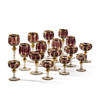 View 1 of Lot 75: A Bohemian Amethyst-Tinted and Gilt-Glass Table Service, Late 19th/Early 20th century