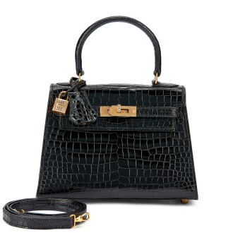 View 1 of Lot 5527: Vintage Black Shiny Porosus Crocodile Mini Kelly 20 I 18K Yellow Gold and Diamond Hardware, 1990s