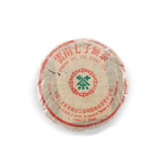 View 1 of Lot 8679: 80年代早期 厚紙8582青餅 Early 1980s Thick Wrapped Paper 8582 Raw Tea Cake (1 PC)