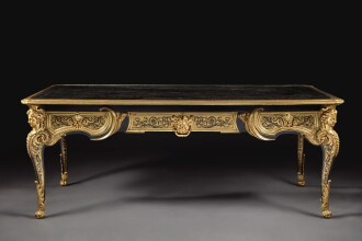 View 1 of Lot 172: A LOUIS XIV GILT-BRONZE MOUNTED BRASS AND TORTOISESHELL CONTRE-PARTIE MARQUETRY BUREAU PLAT ATTRIBUTED TO ANDRE-CHARLES BOULLE, CIRCA 1715
