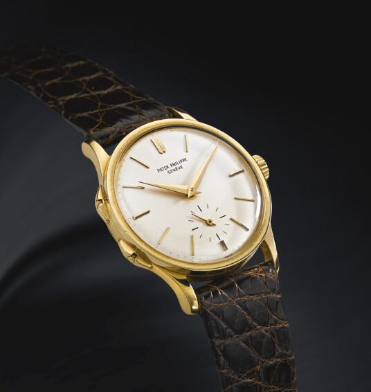 A FINE AND RARE 18K YELLOW GOLD WRISTWATCH WITH ADJUSTABLE JUMPI