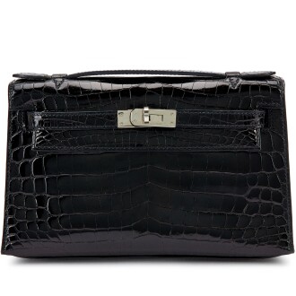 View 1 of Lot 7867: Black Shiny Niloticus Crocodile Kelly Pochette Palladium Hardware, 2008