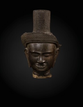 View 1 of Lot 235: A sandstone head of a deity, probably Shiva Khmer, Banteay Srei style, late 10th century | 高棉 十世紀晚期 班迭斯雷式砂岩雕或為濕婆首像