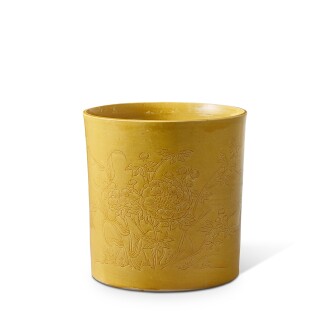 View 1 of Lot 388: A unique incised yellow-glazed 'peony and chrysanthemum' brushpot, Transitional period 明末清初 黃釉劃花卉紋筆筒