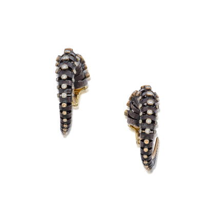 Catalog image of Pair of Silver, Gold and Diamond 'Horn' Earclips