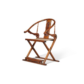 View 1 of Lot 8: A very rare and important 'huanghuali' folding horseshoe-back armchair (Jiaoyi), Late Ming / early Qing dynasty, 17th century