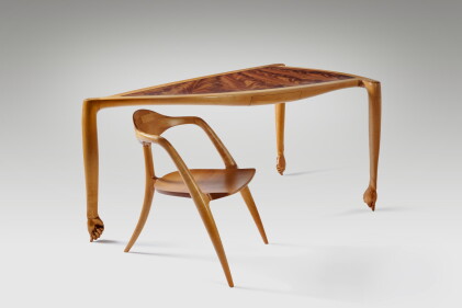Catalog image of "Three-Legged Thumb" Desk and Armchair