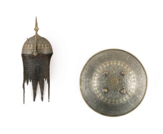 View 1 of Lot 142: A gold-overlaid steel helmet (kulah khud) and shield, Persia, Qajar, mid-19th century