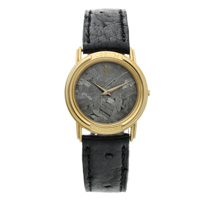 Catalog image of Reference 50.450.56 A yellow gold wristwatch with meteorite dial, Circa 1995