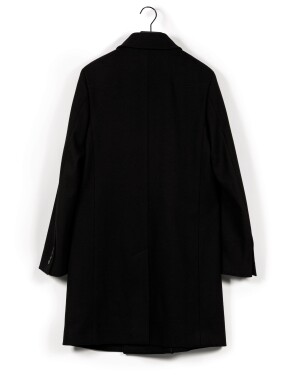 View 1 of Lot 390: Black Cashmere and Wool Coat, circa 2000 | Manteau en laine et cachemire noir, circa 2000