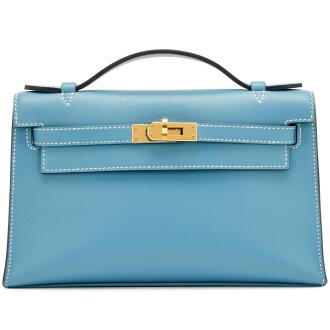 View 1 of Lot 52: New Bleu Jean Swift Kelly Pochette Gold Hardware, 2023