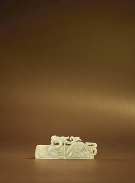 View 1 of Lot 79: A carved pale green jade ‘chilong' scabbard slide, Western Han dynasty