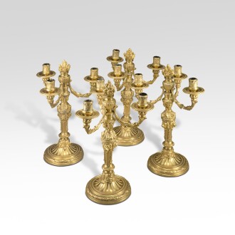 View 1 of Lot 71: A set of four Italian gilt-bronze candelabra, attributed to the Valadier workshop, Rome, late 18th century