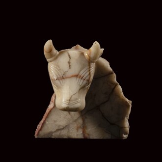 View 1 of Lot 8: A South Arabian Veined Alabaster Bull Stele Fragment, Qataban, 3rd Century B.C./1st Century A.D.