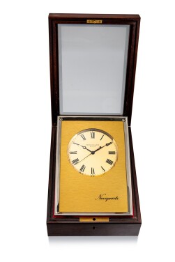 View 1 of Lot 8052: Patek Philippe | Naviquartz, Reference 1208, An aluminium table clock with mahogany wooden case, Made in 1983 | 百達翡麗 | Naviquartz 型號1208 鋁金屬座鐘，備桃花心木盒子，1983年製
