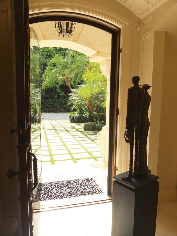 Rowan Gillespie’s The Settlers in the hallway of the Burns family home. Image courtesy of Roger Kohn.
