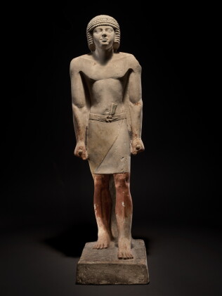 Catalog image of An Egyptian Limestone Figure of a Man, late 5th Dynasty, circa 2440-2355 B.C.