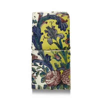 Catalog image of two qajar polychrome floral pottery tiles, persia, 19th century