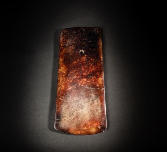 View 1 of Lot 87: A superb reddish-brown jade axe, Neolithic period | 新石器時代 褐玉鏟