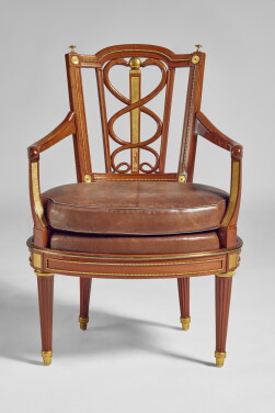 View 1 of Lot 201: A German Neoclassical Brass-Mounted Mahogany Armchair Attributed to David Roentgen, Circa 1785