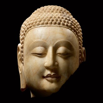 View 1 of Lot 5: A superbly carved rare marble fragmentary head of Shakyamuni Buddha Northern Qi dynasty | 北齊 大理石釋迦牟尼佛首