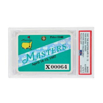 View 1 of Lot 20: Tiger Woods Signed 1997 Masters Badge | PSA/DNA Authentic, Auto 9 | Woods' 1st Masters Victory | Youngest Masters Champion | Largest Masters Margin of Victory | 1997-2000 Era Signature