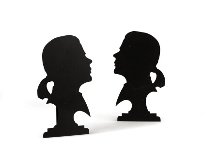 Catalog image of A pair of Karl Lagerfeld's profiles forming candlesticks, circa 1980-1990